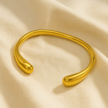 Load image into Gallery viewer, Top view of MJ Luxe Ava Gold Cuff Bracelet, open sculptural bangle with polished golden finish, timeless minimalist jewellery.