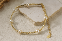 Load image into Gallery viewer, Elise Gold Pearl Beaded Bracelet styled on soft natural stone background, dainty minimalist gold and pearl bracelet for women by MJ Luxe, waterproof and tarnish resistant luxury jewellery.
