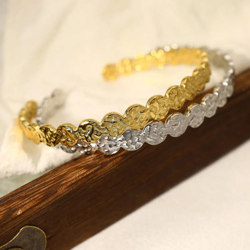 Close-up of MJ Luxe hammered gold and silver coin cuff bracelets with textured finish, stackable minimalist design, modern jewellery for women.