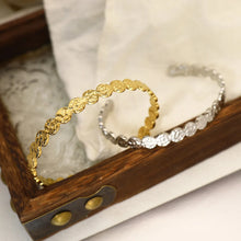 Load image into Gallery viewer, Hammered gold coin cuff bracelet displayed in jewellery box alongside silver version, waterproof tarnish resistant cuff by MJ Luxe.
